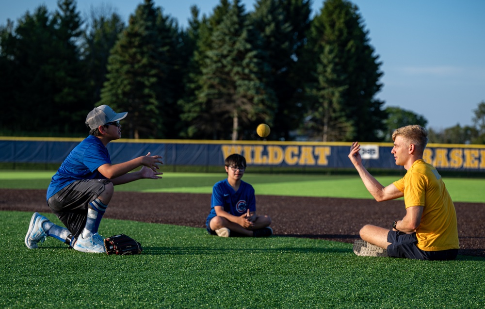 Sailors play baseball with local children during Navy Week Milwaukee 2025