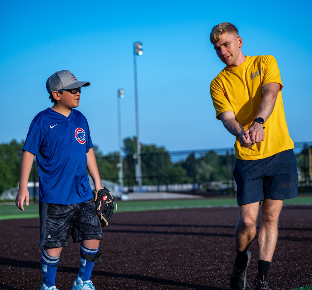 Sailors play baseball with local children during Navy Week Milwaukee 2025