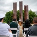Sailors participate in a ceremony at the Milwaukee Vietnam Veterans Memorial during Navy Week Milwaukee 2025