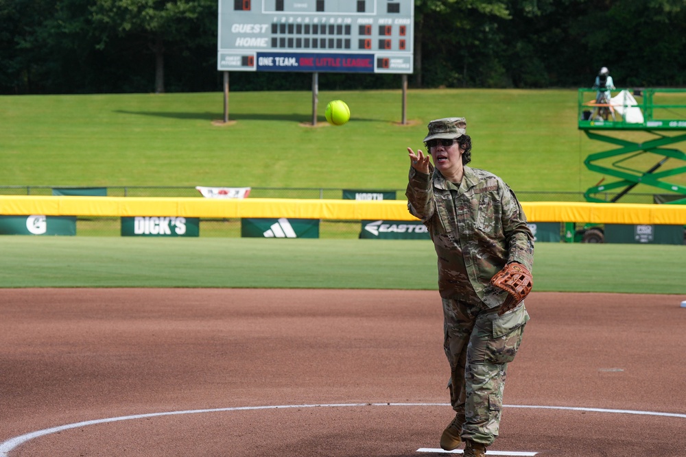 Col. Kerya Reyes throws first pitch in Little League Softball Southeast Tournament