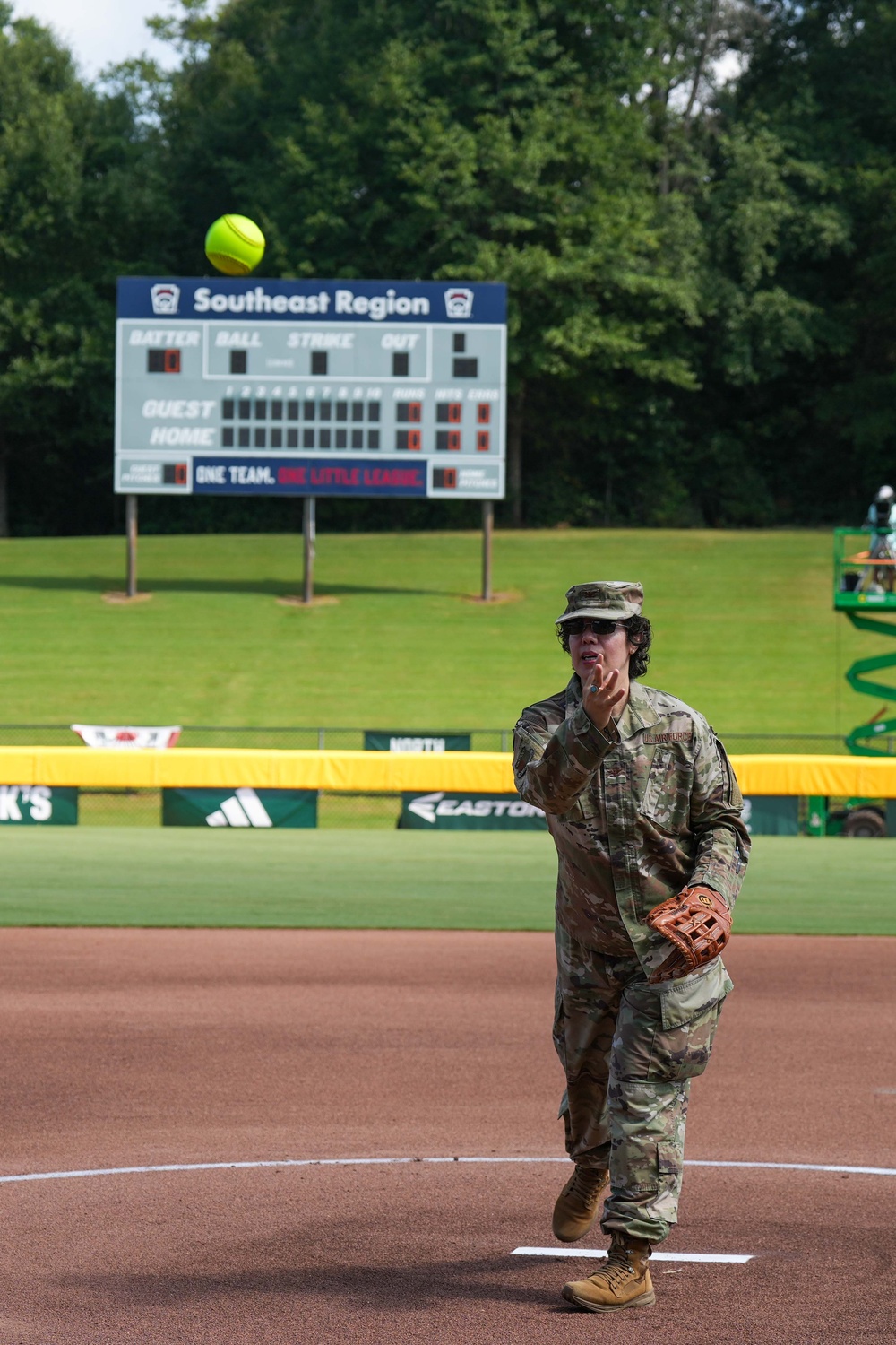 Col. Kerya Reyes throws first pitch in Little League Softball Southeast Tournament