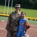Col. Kerya Reyes throws first pitch in Little League Softball Southeast Tournament