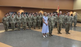Nevada Congresswoman Susie Lee and Colonel Choli C. Ence stand in formation