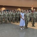 Nevada Congresswoman Susie Lee and Colonel Choli C. Ence stand in formation