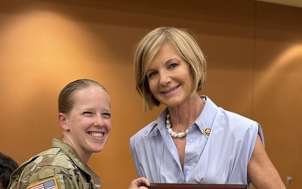 Sergeant Megan Case presents a token of appreciation to Nevada Congresswoman Susie Lee