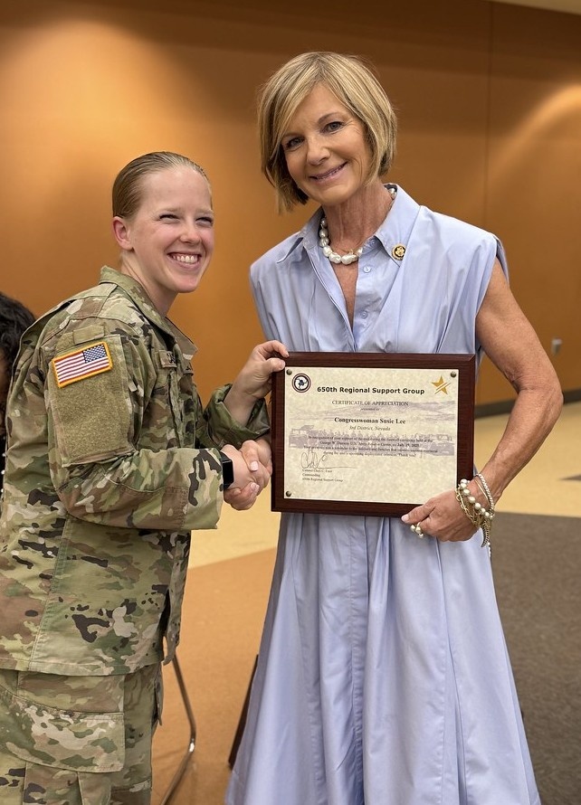 Sergeant Megan Case presents a token of appreciation to Nevada Congresswoman Susie Lee