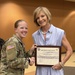 Sergeant Megan Case presents a token of appreciation to Nevada Congresswoman Susie Lee