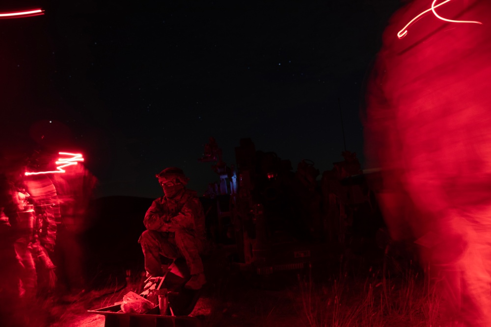 2-146 Field Artillery Regiment fires M777 howitzers at night