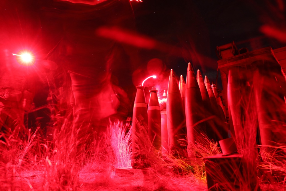 2-146 Field Artillery Regiment fires M777 howitzers at night