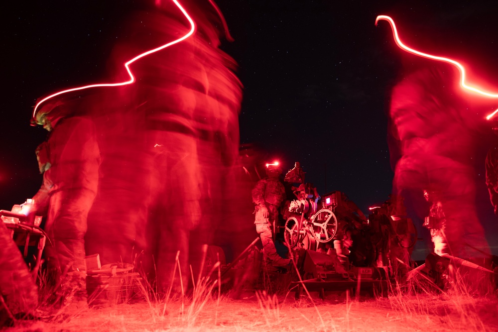 2-146 Field Artillery Regiment fires M777 howitzers at night