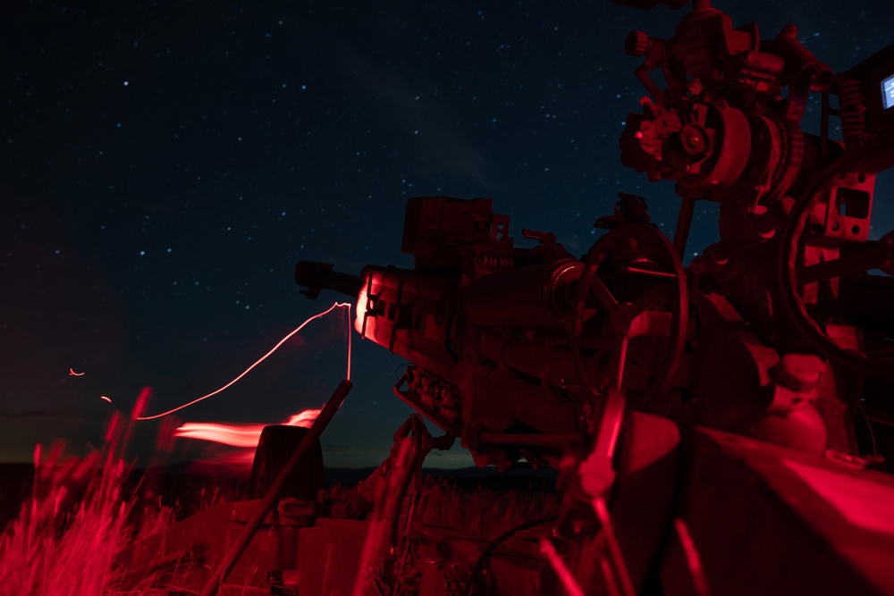 2-146 Field Artillery Regiment fires M777 howitzers at night