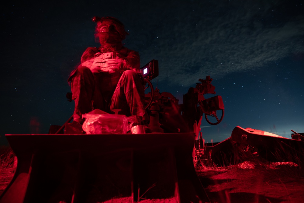 2-146 Field Artillery Regiment fires M777 howitzers at night