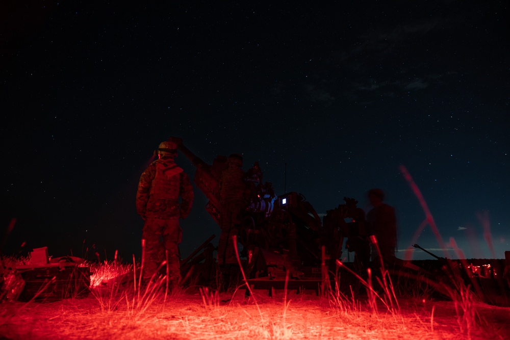 2-146 Field Artillery Regiment fires M777 howitzers at night
