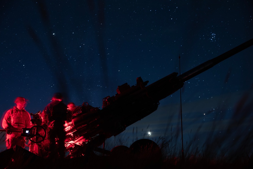 2-146 Field Artillery Regiment fires M777 howitzers at night