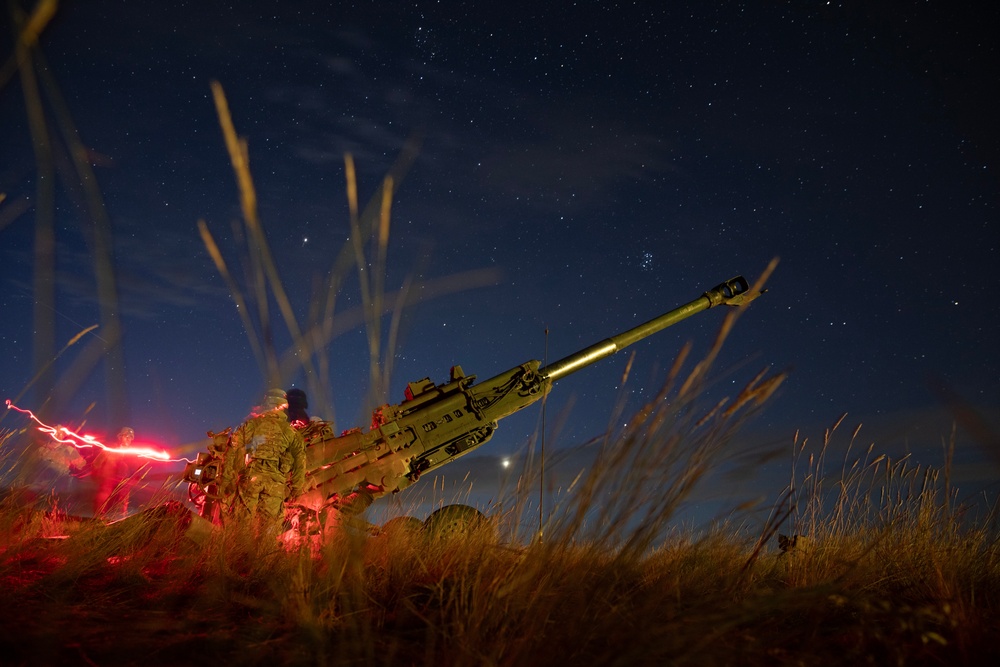 2-146 Field Artillery Regiment fires M777 howitzers at night