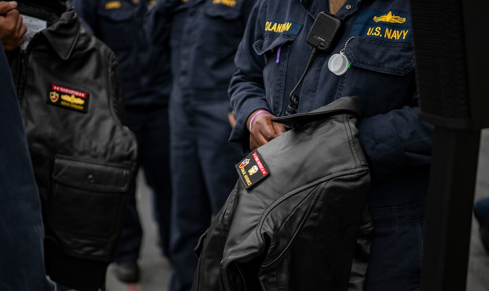 USS ESSEX (LHD 2) Surface Warfare Officer leather jacket presentation ceremony.
