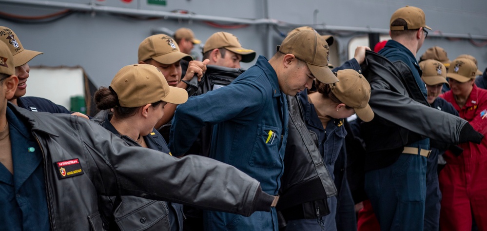 USS ESSEX (LHD 2) Surface Warfare Officer leather jacket presentation ceremony.