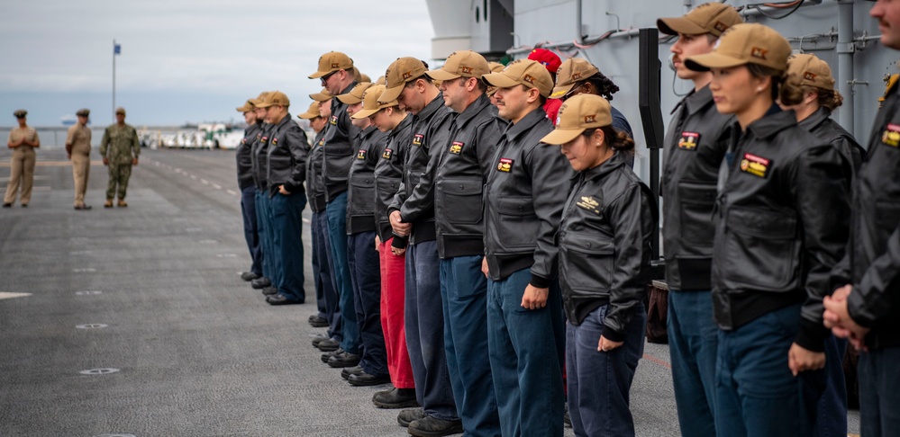 USS ESSEX (LHD 2) Surface Warfare Officer leather jacket presentation ceremony.