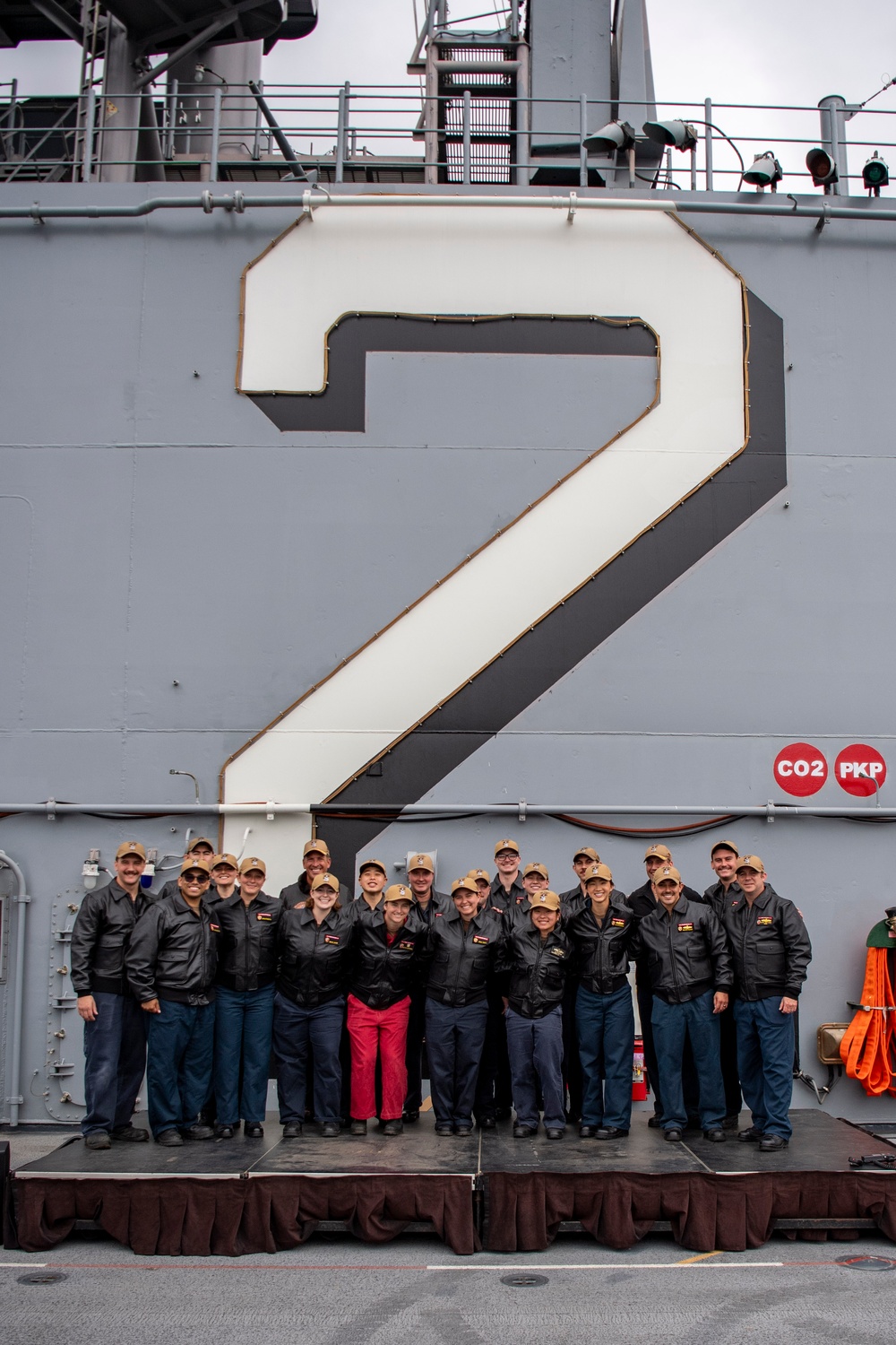 USS ESSEX (LHD 2) Surface Warfare Officer leather jacket presentation ceremony.