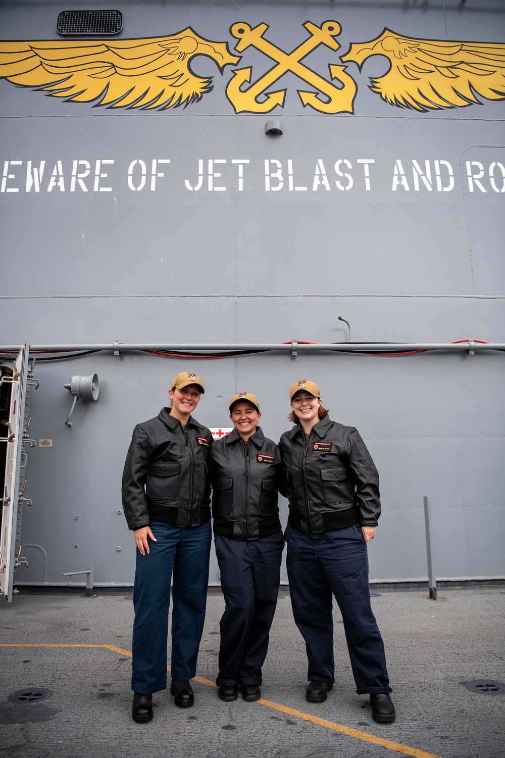USS ESSEX (LHD 2) Surface Warfare Officer leather jacket presentation ceremony.