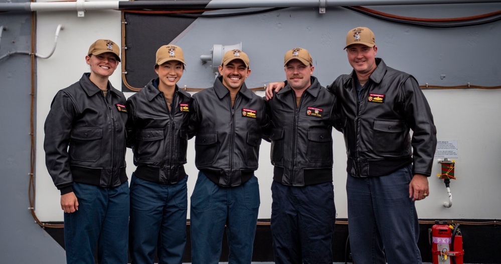 USS ESSEX (LHD 2) Surface Warfare Officer leather jacket presentation ceremony.