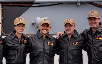 USS ESSEX (LHD 2) Surface Warfare Officer leather jacket presentation ceremony.