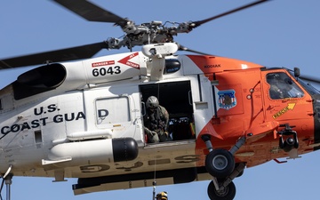 Alaska based Coast Guard aviators showcase rescue demonstration during multi-agency hoist symposium
