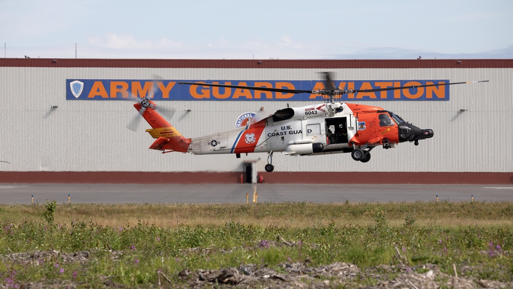 Alaska based Coast Guard aviators showcase rescue demonstration during multi-agency hoist symposium
