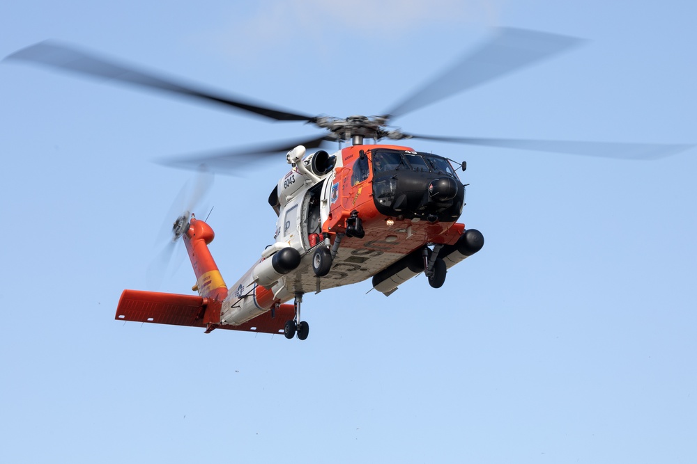 Alaska based Coast Guard aviators showcase rescue demonstration during multi-agency hoist symposium
