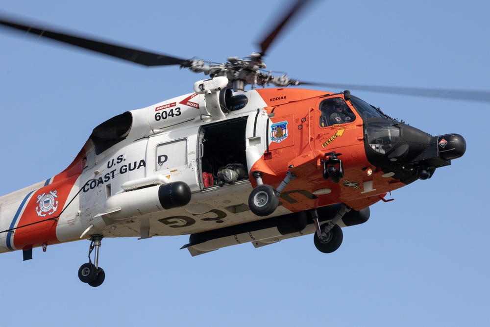 Alaska based Coast Guard aviators showcase rescue demonstration during multi-agency hoist symposium