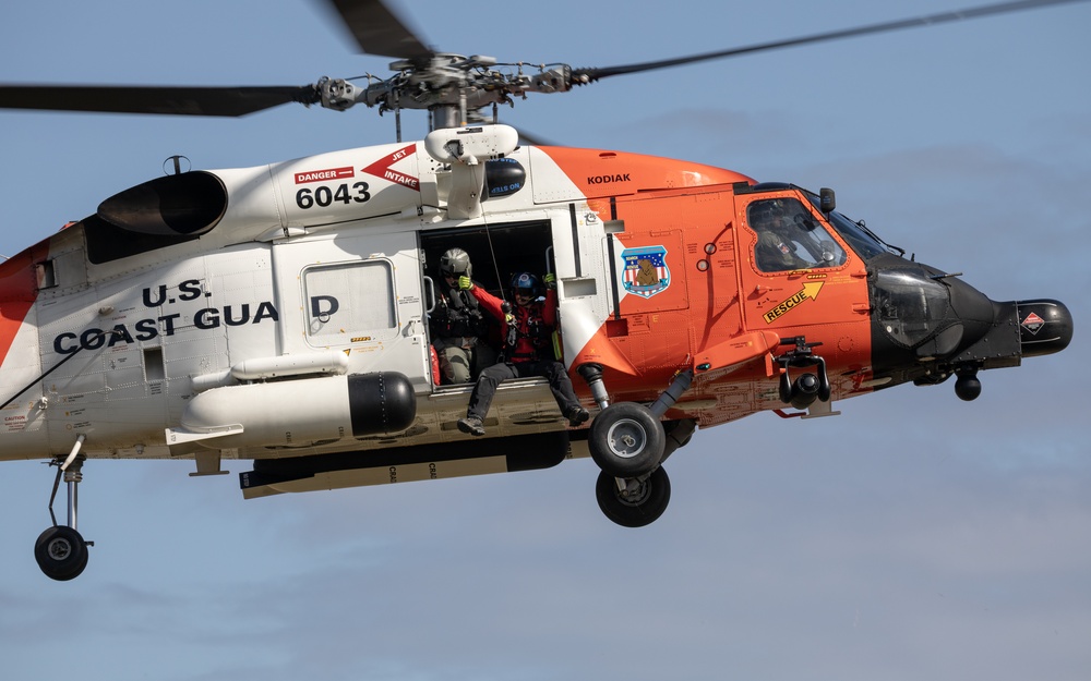 Alaska based Coast Guard aviators showcase rescue demonstration during multi-agency hoist symposium