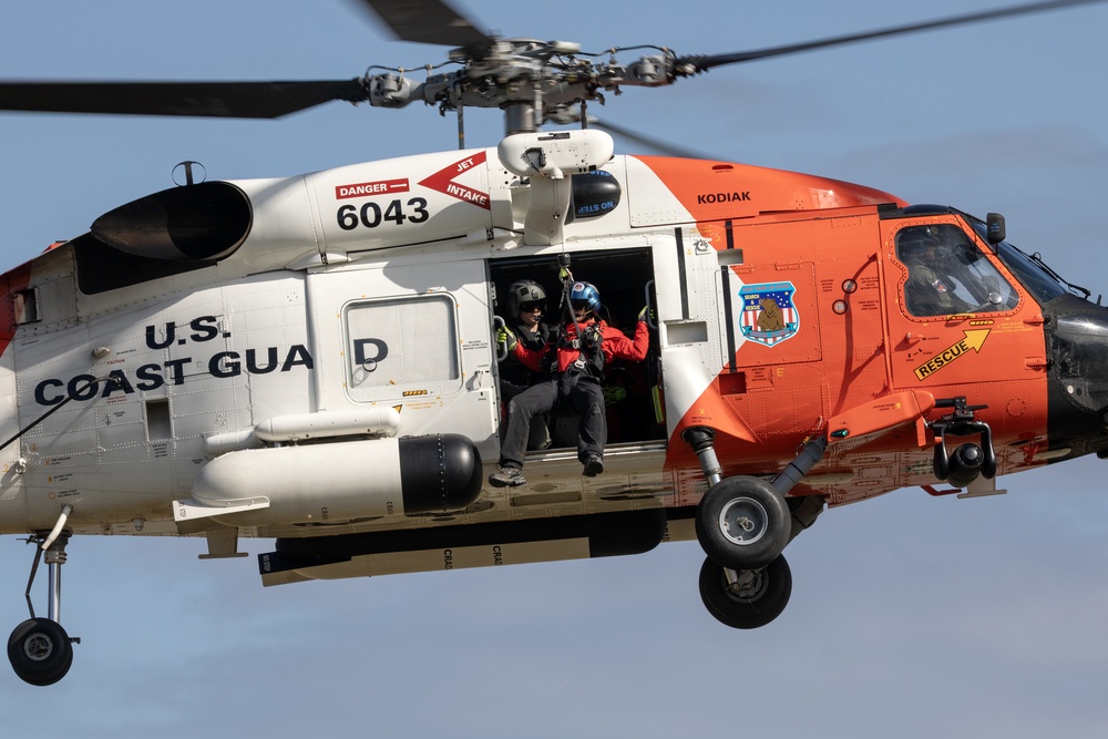 Alaska based Coast Guard aviators showcase rescue demonstration during multi-agency hoist symposium