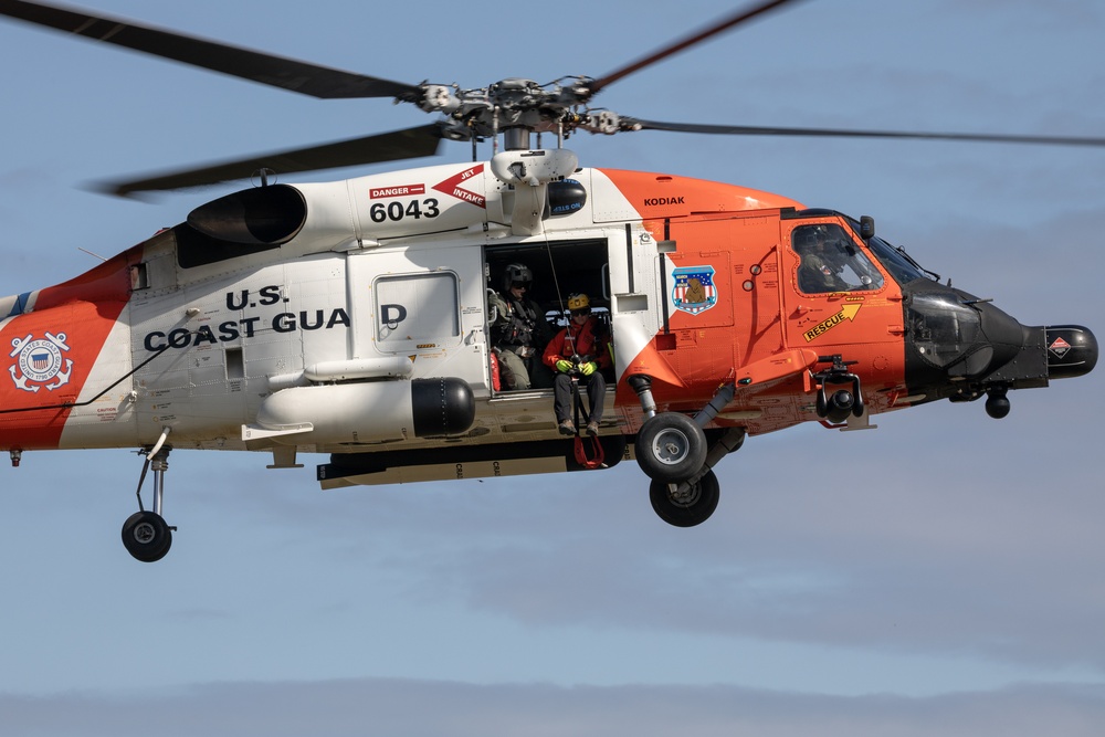 Alaska based Coast Guard aviators showcase rescue demonstration during multi-agency hoist symposium