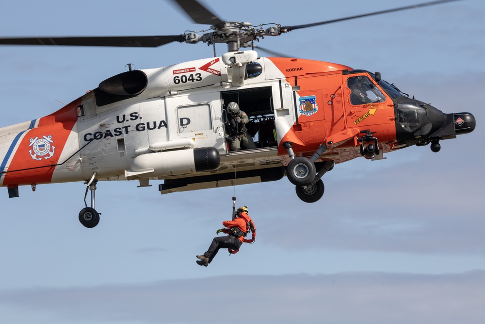 Alaska based Coast Guard aviators showcase rescue demonstration during multi-agency hoist symposium