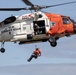 Alaska based Coast Guard aviators showcase rescue demonstration during multi-agency hoist symposium
