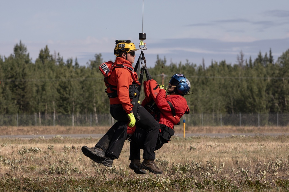Alaska based Coast Guard aviators showcase rescue demonstration during multi-agency hoist symposium