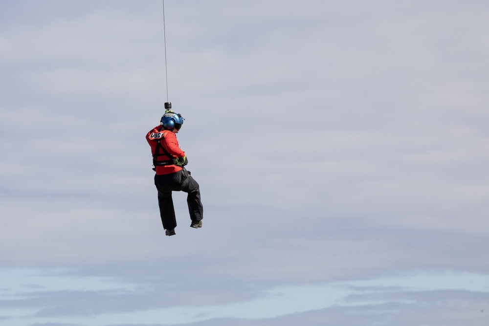 Alaska based Coast Guard aviators showcase rescue demonstration during multi-agency hoist symposium
