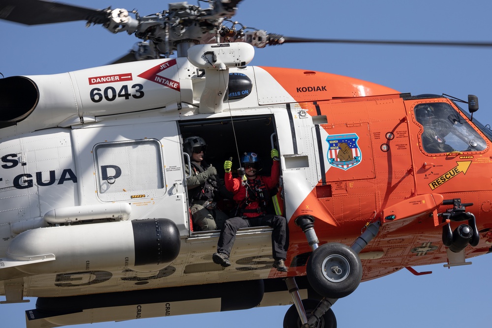 Alaska based Coast Guard aviators showcase rescue demonstration during multi-agency hoist symposium
