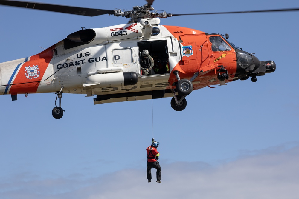 Alaska based Coast Guard aviators showcase rescue demonstration during multi-agency hoist symposium