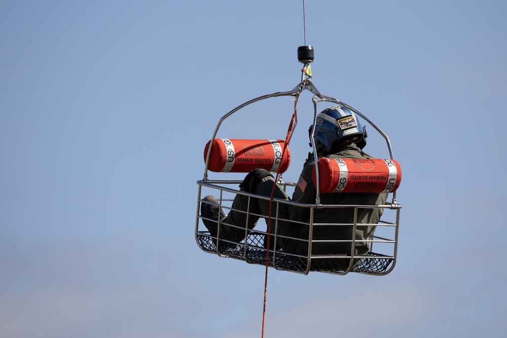 Alaska based Coast Guard aviators showcase rescue demonstration during multi-agency hoist symposium
