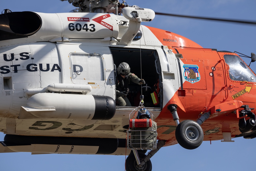 Alaska based Coast Guard aviators showcase rescue demonstration during multi-agency hoist symposium