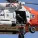 Alaska based Coast Guard aviators showcase rescue demonstration during multi-agency hoist symposium