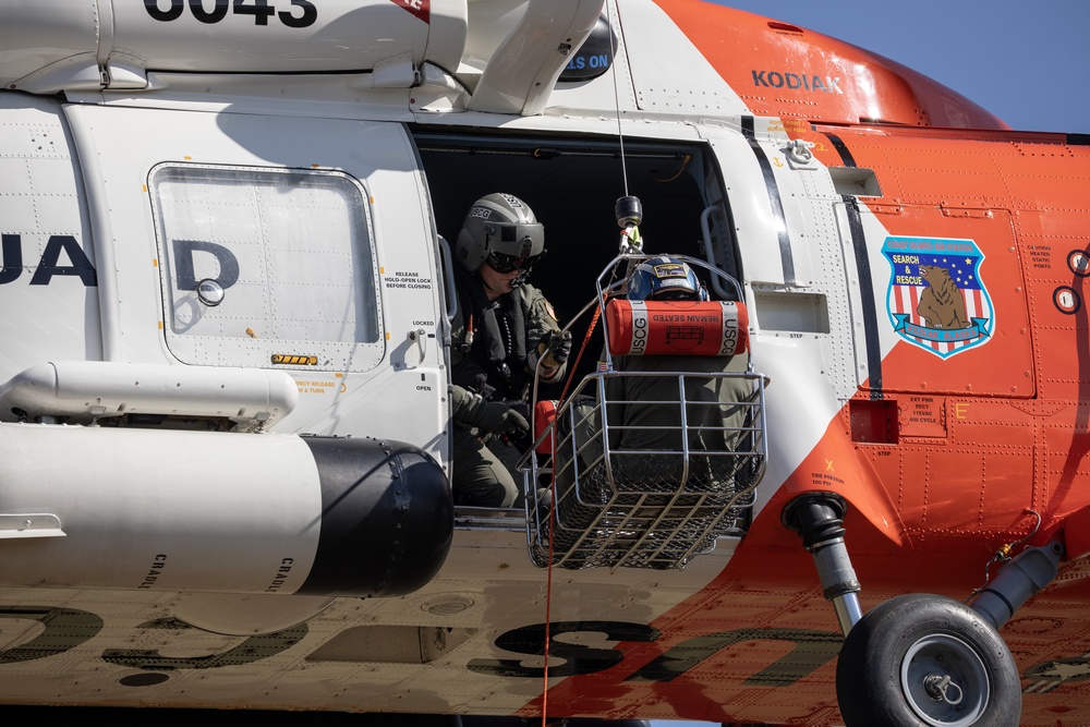 Alaska based Coast Guard aviators showcase rescue demonstration during multi-agency hoist symposium