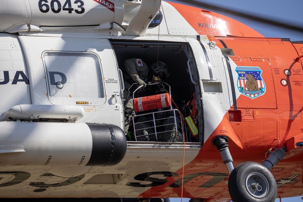 Alaska based Coast Guard aviators showcase rescue demonstration during multi-agency hoist symposium