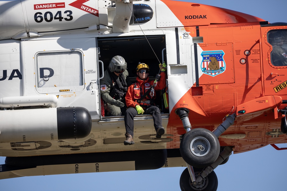 Alaska based Coast Guard aviators showcase rescue demonstration during multi-agency hoist symposium