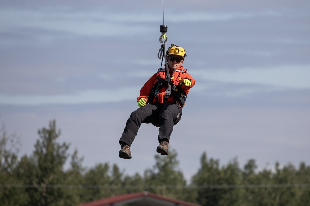 Alaska based Coast Guard aviators showcase rescue demonstration during multi-agency hoist symposium