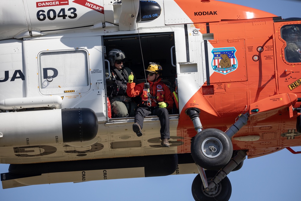 Alaska based Coast Guard aviators showcase rescue demonstration during multi-agency hoist symposium