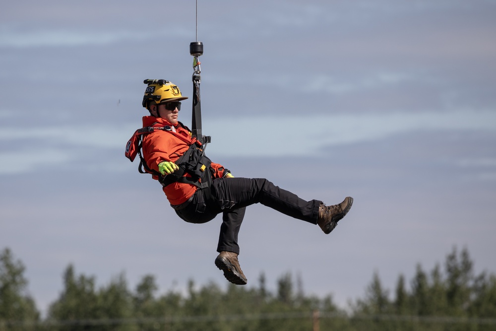 Alaska based Coast Guard aviators showcase rescue demonstration during multi-agency hoist symposium