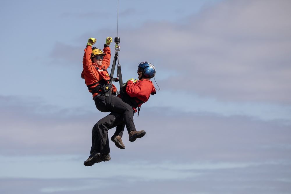 Alaska based Coast Guard aviators showcase rescue demonstration during multi-agency hoist symposium