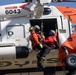 Alaska based Coast Guard aviators showcase rescue demonstration during multi-agency hoist symposium
